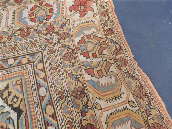 A large Indian carpet, circa 1910, 16ft 1in x 21ft 4in. (652cm x 491cm), fragment 5ft 11in. x 3ft 6in.